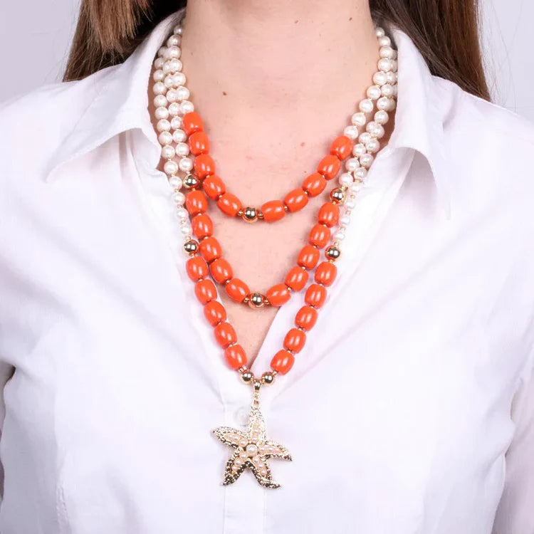 Collana in Metallo stella marina con sfere rosse e bianche