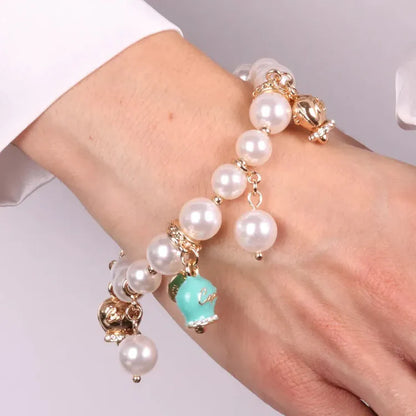 AmoCapri Bracciale in Metallo Bracciale in Metallo con perle e campanelle tiffany