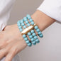 Bracciale in Metallo con sfere turchesi e pesce con rifiniture martellate