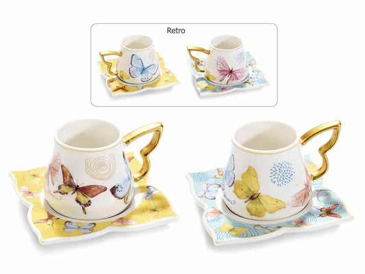 Set 2 tazzine e 2 piattini Farfalla porcellana decori dorati Misure: Tazzina: Ø 6 cm x 5,5 H Capacità: 80 ml - Piattino: 9,5 x 9,5 H Assortimento: 2 fantasie Utilizzo: Tazze