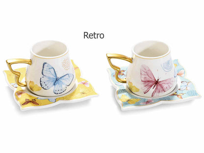 Set 2 tazzine e 2 piattini Farfalla porcellana decori dorati Misure: Tazzina: Ø 6 cm x 5,5 H Capacità: 80 ml - Piattino: 9,5 x 9,5 H Assortimento: 2 fantasie Utilizzo: Tazze