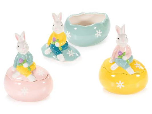 Barattolo alimentare in ceramica a uovo con coniglio Misure: cm 13,5 x 10 x 18 H Assortimento: 3 colori Utilizzo: Barattoli/Contenitori