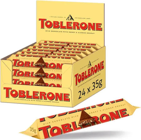 BARRETTA TOBLERONE CIOCCOLATO SVIZZERO  A LATTE CON TORRONE MANDORLE E MIELE 35 GR.